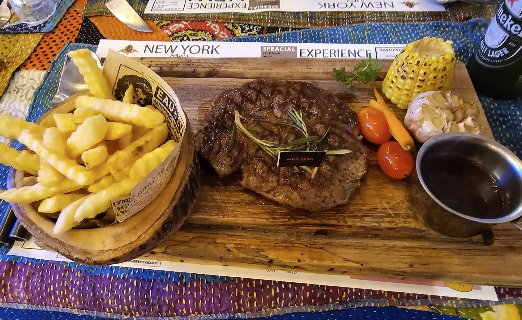 Steak with fries on board